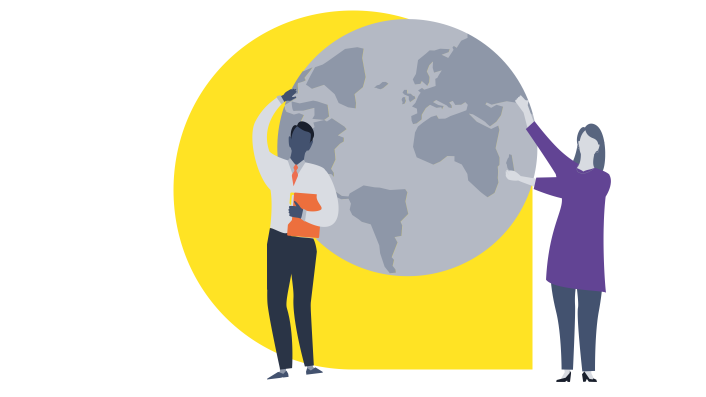 Teachers holding up the globe